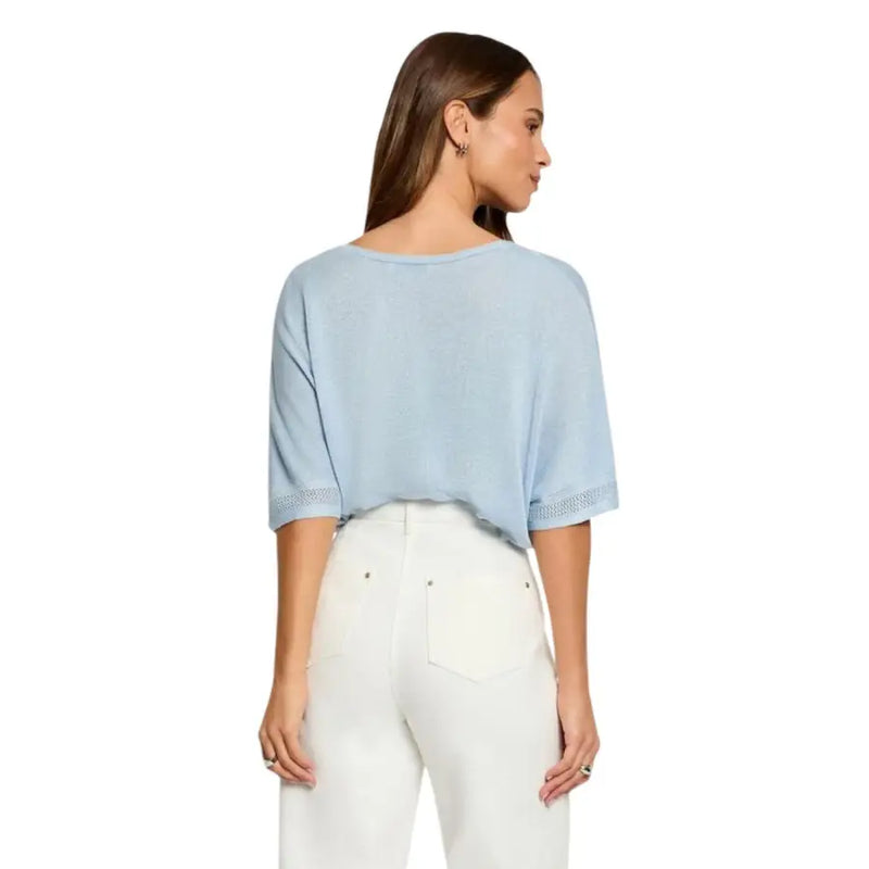 Light blue loose-fitting short sleeve v-neck knit top for women with delicate lace trim at the cuffs