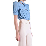 Light blue viscose blouse by Elisabetta Franchi with puffed short sleeves and a tie-neck detail