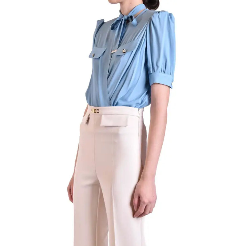 Light blue viscose short sleeve blouse by Elisabetta Franchi with puffed sleeves and tie neck detail
