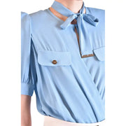 Light blue viscose short sleeve blouse by Elisabetta Franchi with tie neck detail and gold toned button accents