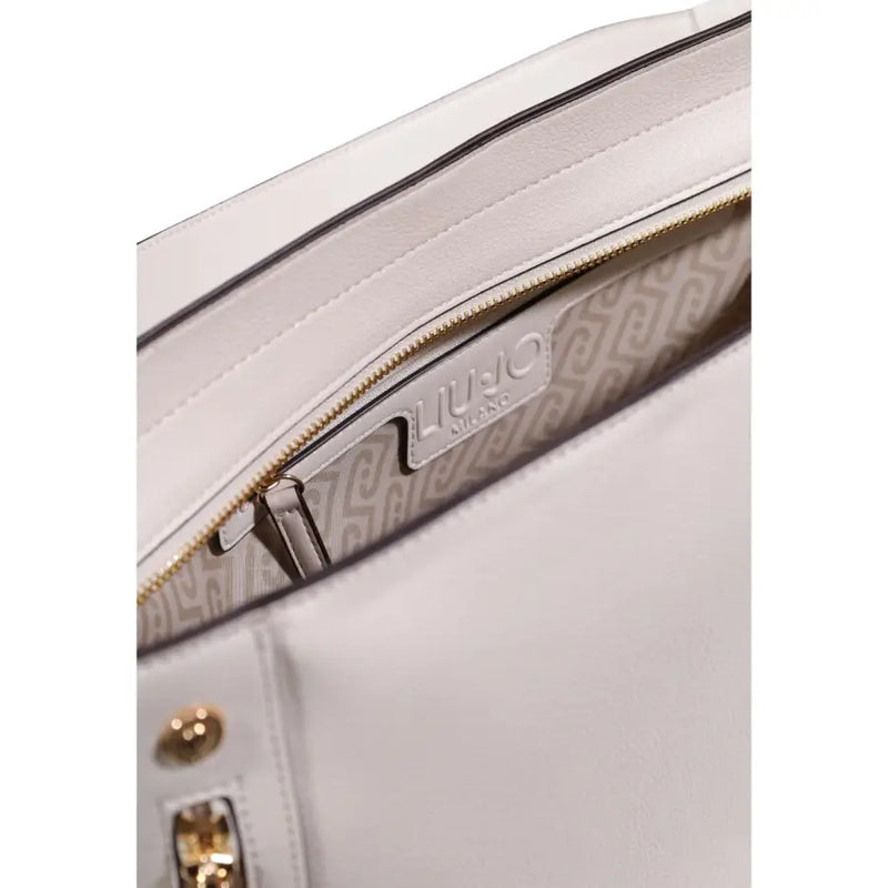 Liu Jo beige leather handbag with shoulder strap and pockets featuring sleek white leather and gold-tone hardware interior