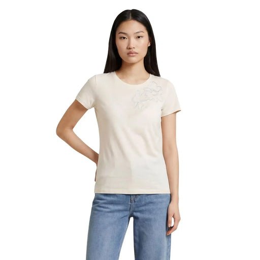 Liu Jo Beigefarbenes Damen-T-Shirt aus Baumwolle mit kurzen Ärmeln, Rundhalsausschnitt und dezenter, gestickter Blumenapplikation auf der Brust