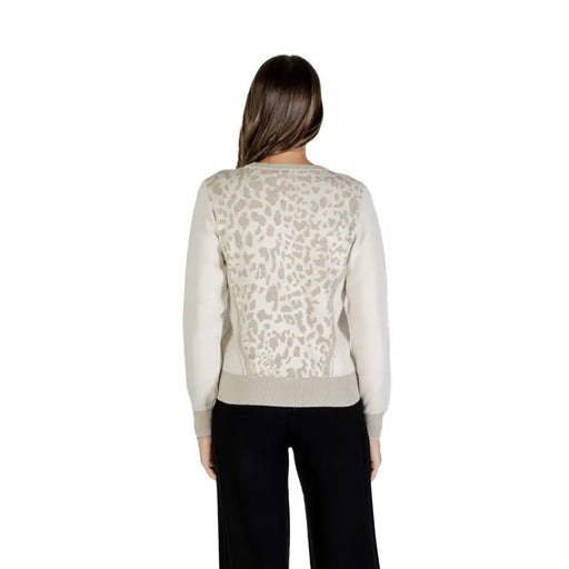 Woman wearing Liu Jo Women Beige Leopard Long Knitwear with light grey abstract pattern