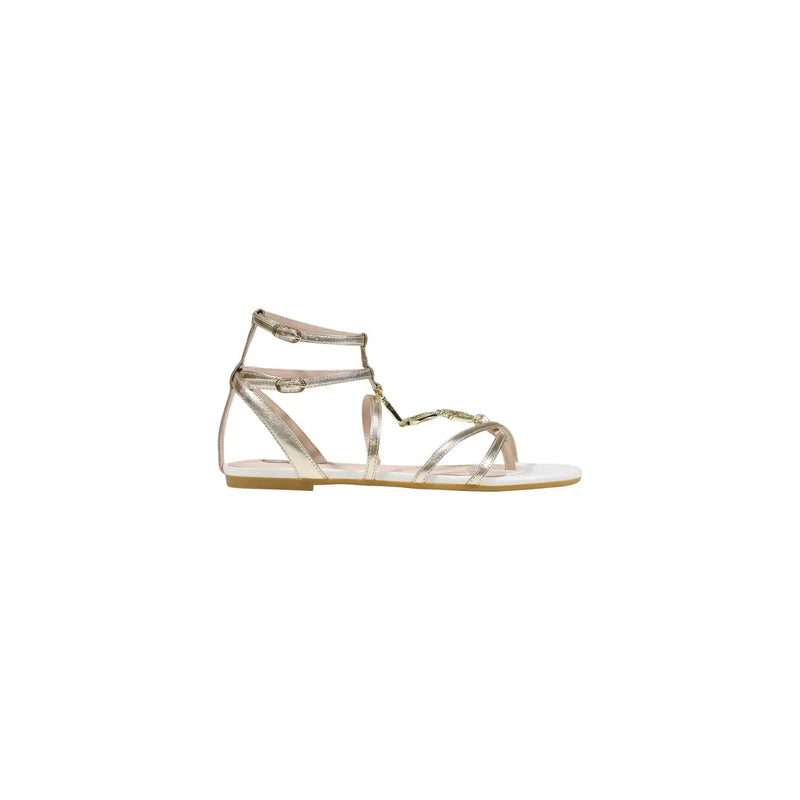 A sleek metallic gold polyurethane sandal with flat sole and adjustable ankle strap by Liu Jo women