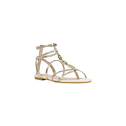 Liu Jo women gold polyurethane ankle strap sandal with delicate straps, white sole, and green gemstone accents