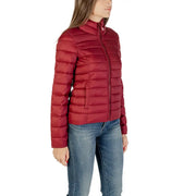 Woman wearing Long Bordeaux Turtleneck Zip Jacket with red puffer jacket and blue jeans