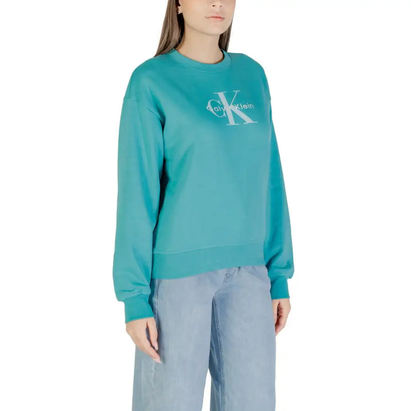 Teal Calvin Klein Jeans women’s long sleeve crew neck sweatshirt displayed in light blue print
