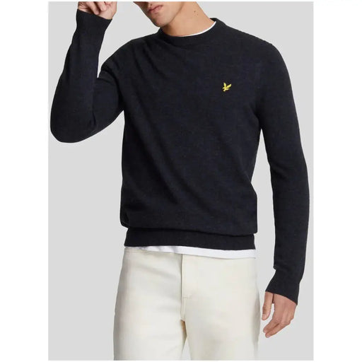 Black crew neck sweater with yellow logo, lyle & scott brand.