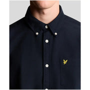 Navy blue lyle & scott long sleeve cotton shirt with white buttons and yellow embroidered bird logo on chest pocket