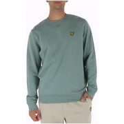 A soft sage green lyle & scott cotton crewneck sweatshirt with a small yellow bird logo on the left chest