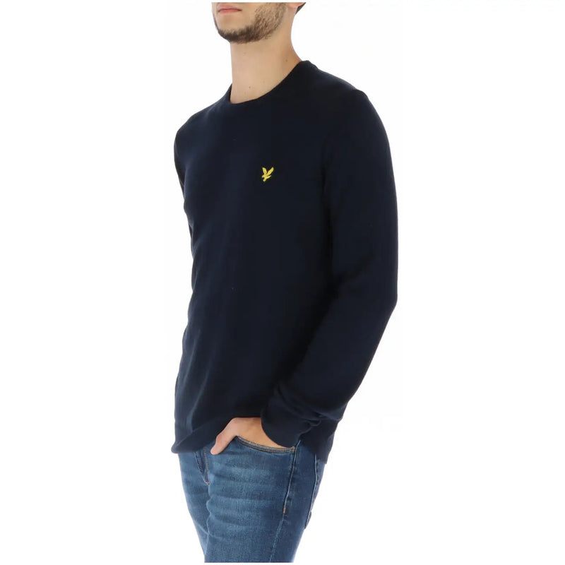 Navy blue long-sleeved crew neck knit sweater by Lyle & Scott with a small yellow embroidered bird logo on left chest