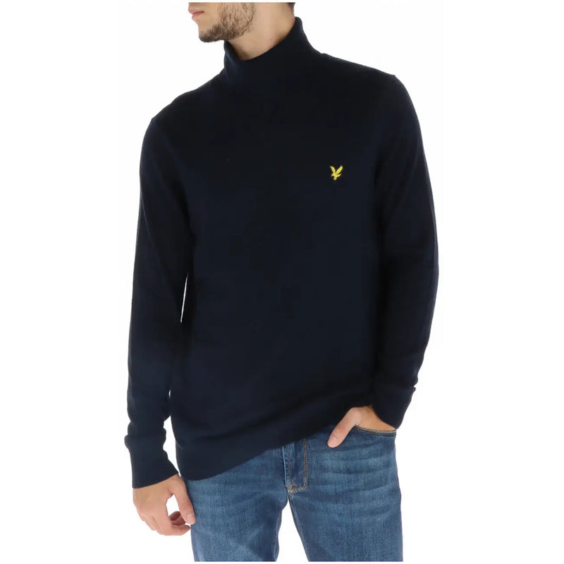 Lyle & Scott men’s navy blue turtleneck sweater featuring a small yellow embroidered bird logo on the chest