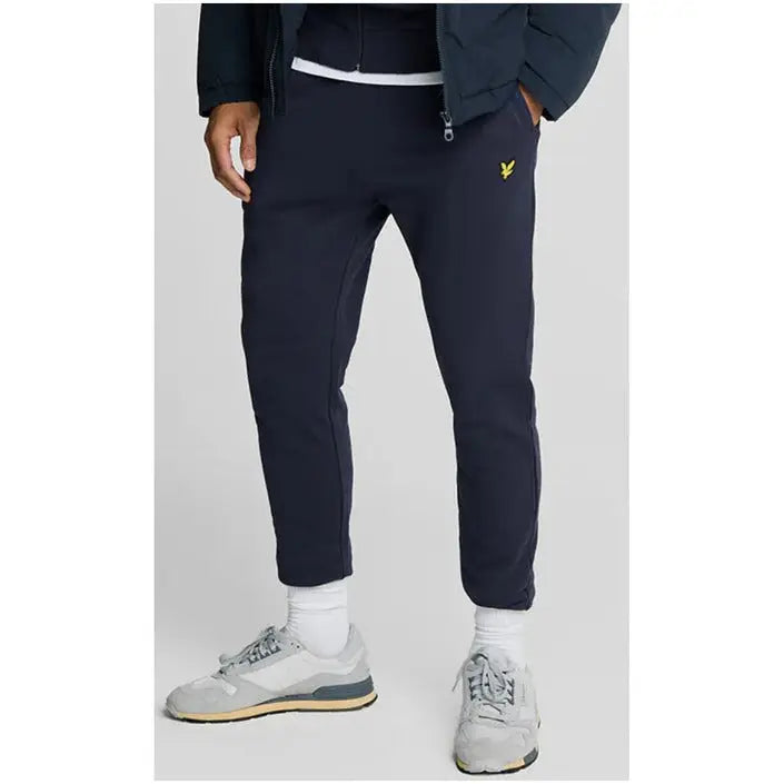 Navy blue Lyle & Scott men’s sweatpants with yellow logo on upper thigh