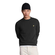 Lyle & Scott Schwarzer Merinowollpullover für Herren mit goldenem Vogellogo auf der linken Brust, Vorderansicht