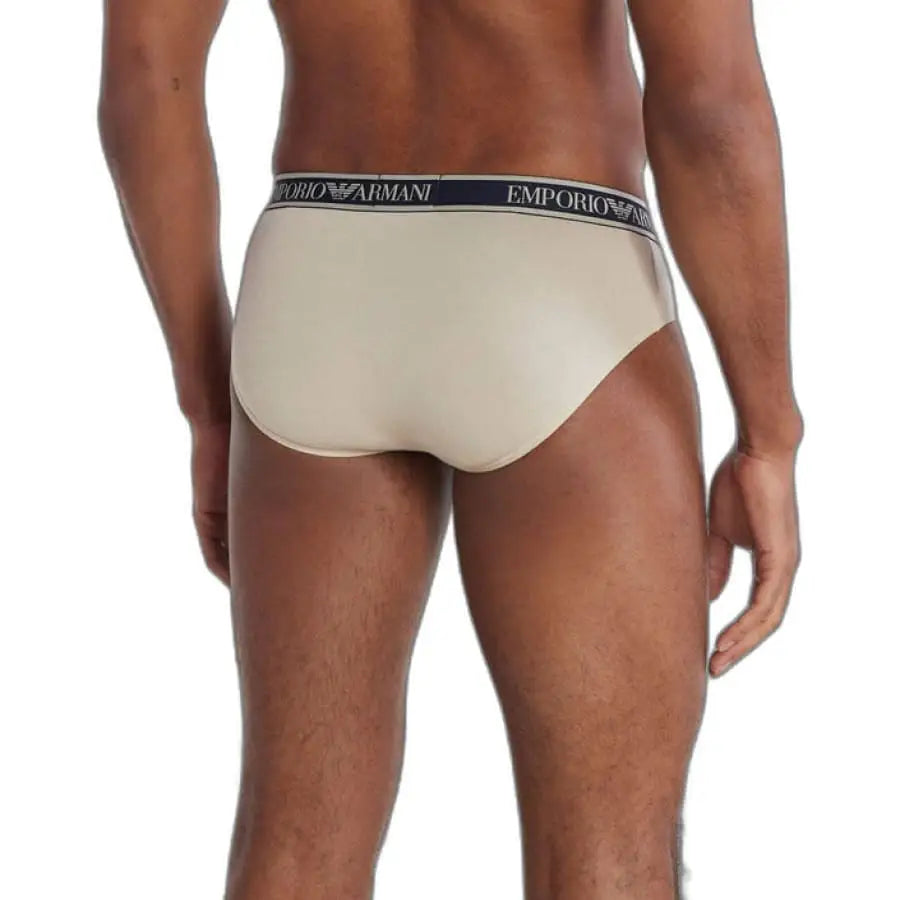 
                      
                        Emporio Armani underwear for men - beige briefs with white and blue stripe detail.
                      
                    