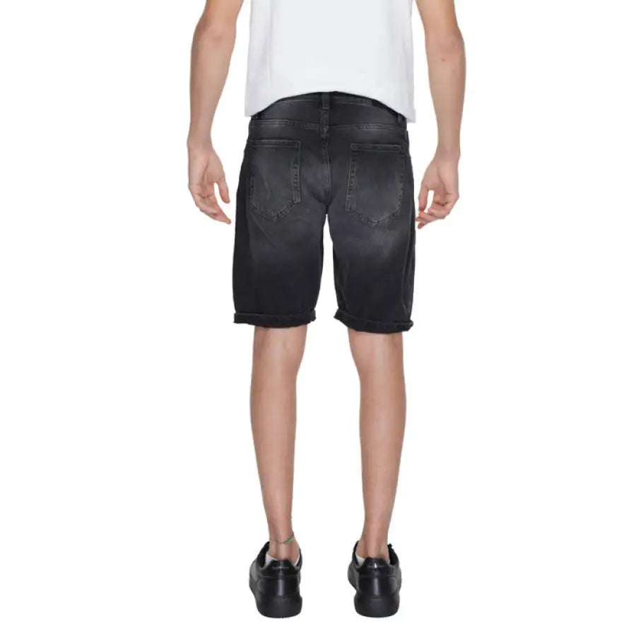 
                      
                        Antony Morato men shorts in urban style clothing, man in white t-shirt and black denim
                      
                    