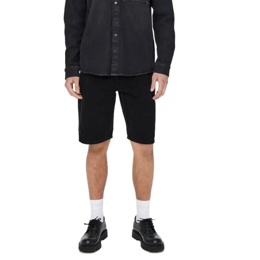 Man in Only & Sons black denim urban city style jacket and shorts