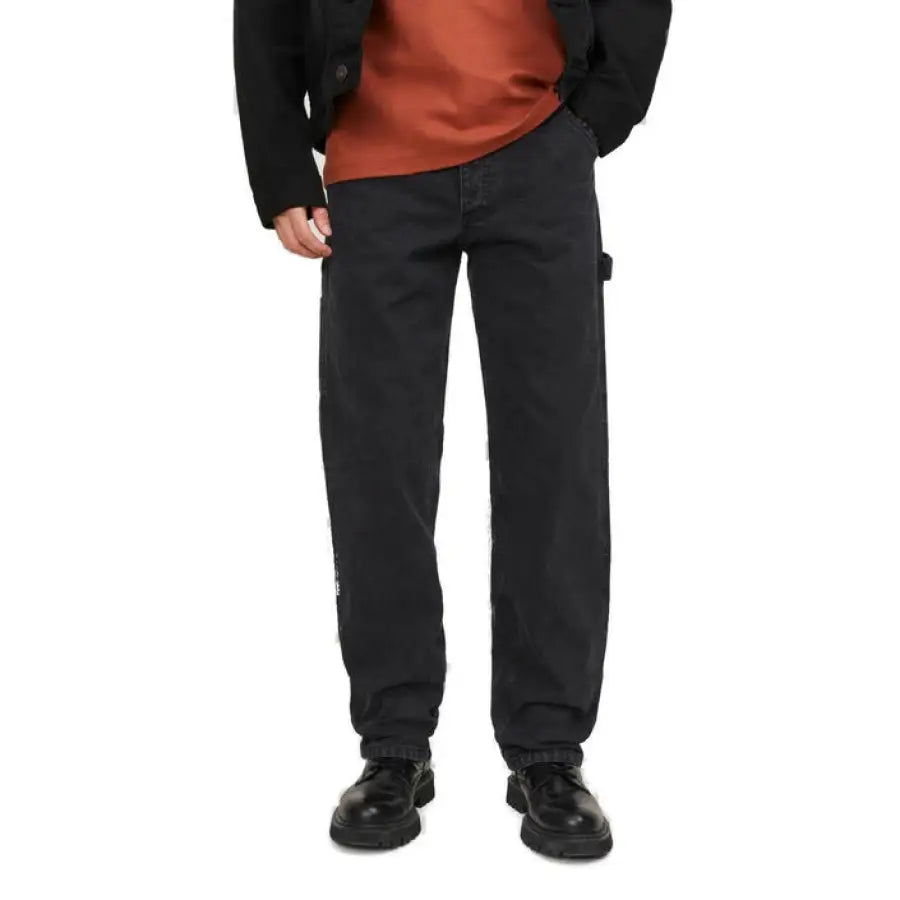 
                      
                        Jack & Jones men jeans featuring man in black jacket embodying urban city fashion
                      
                    