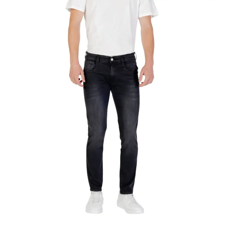 Man wearing black jeans and a white t-shirt showcasing Dark Wash Slim Fit Jeans