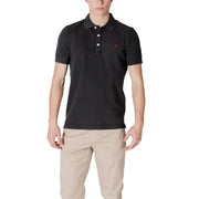 Man wearing a black polo shirt and khaki pants, showcasing Replay Men’s Yellow Polo Shirt