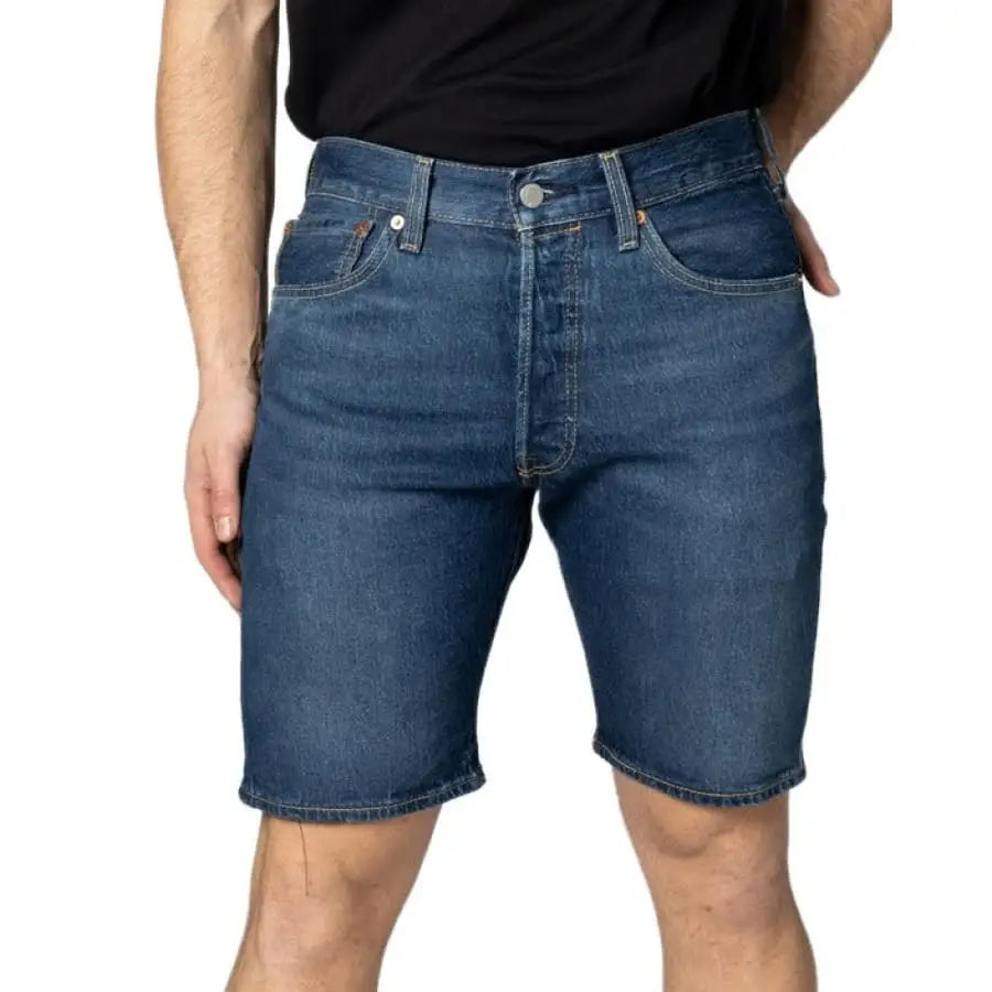 Man wearing Levi`s Men Shorts in black shirt, stylish apparel accessories