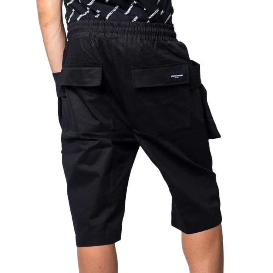 Man wearing Minimal Men Shorts in black, showcasing minimal minimal style.