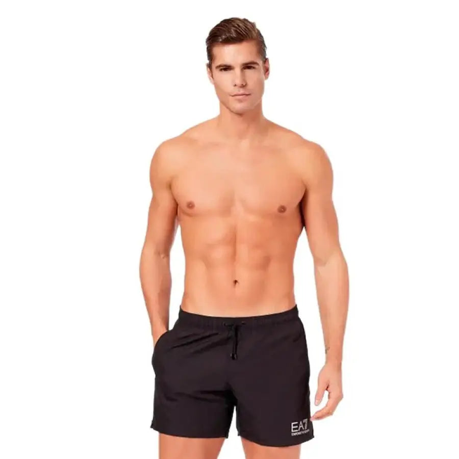 
                      
                        Ea7 Ea7 men in black swim shorts showcasing Ea7 men swimwear collection
                      
                    