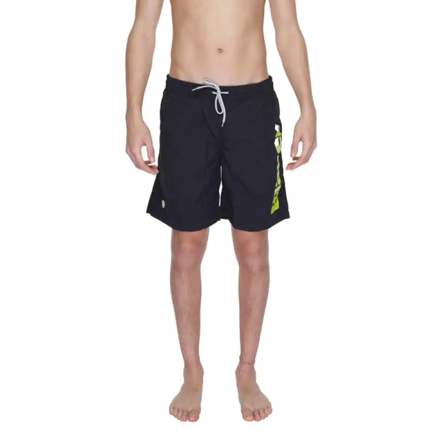 
                      
                        Blauer Blauer Men Swimwear - man in black swimsuit with yellow logo
                      
                    
