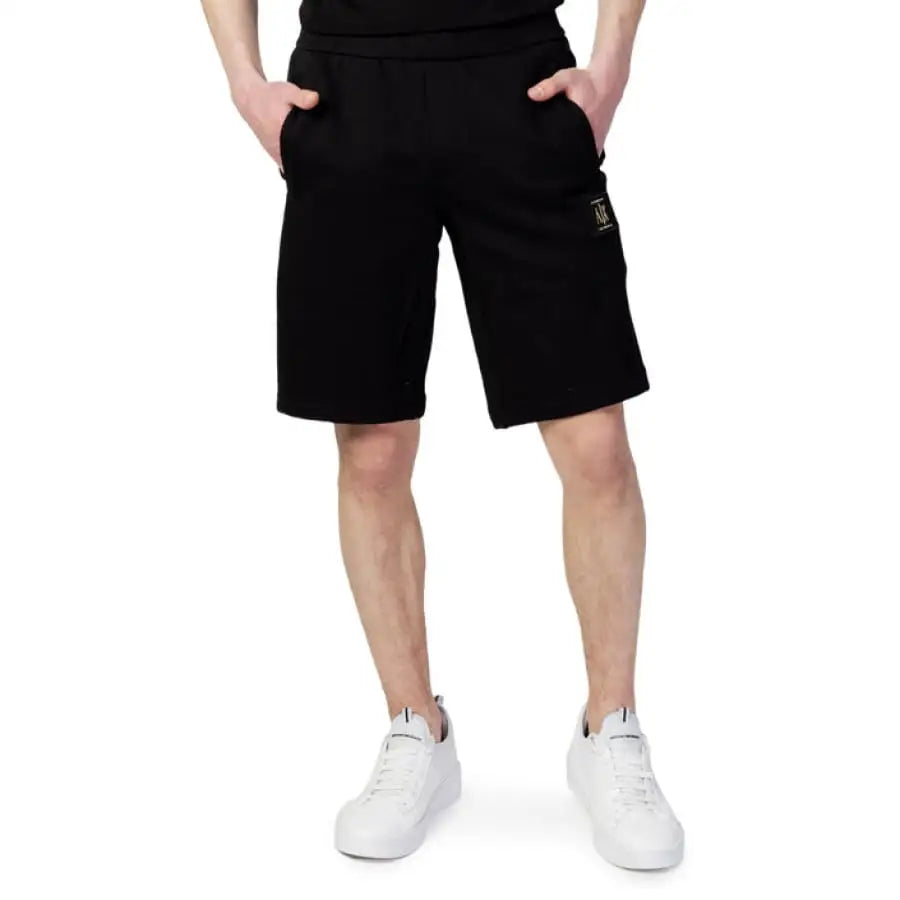 Man wearing Armani Exchange T-shirt and Shorts in product display