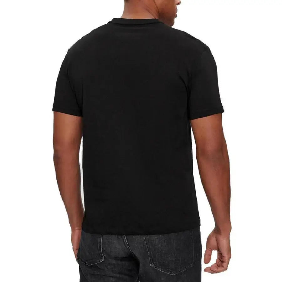
                      
                        Man modeling Armani Exchange Men T-Shirt in black with jeans
                      
                    