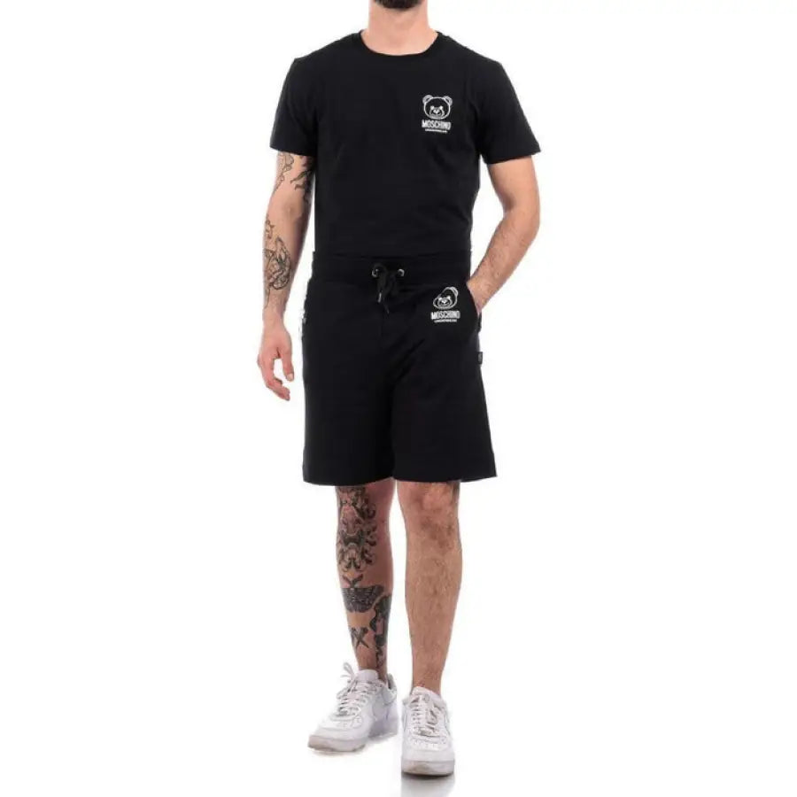
                      
                        Man in Moschino Underwear shorts showcasing urban style clothing in the city
                      
                    