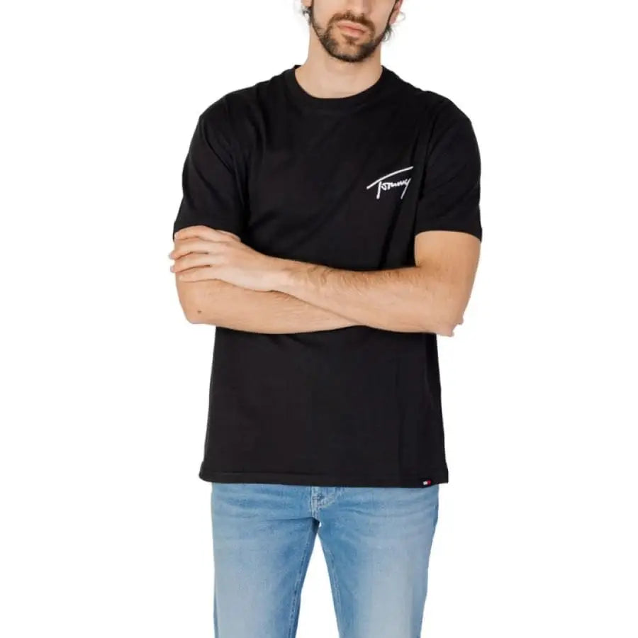 Man in Tommy Hilfiger Jeans black t-shirt with white logo