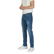 Man in blue jeans and white sneakers wearing Replay Blue Men Trousers Spring Summer