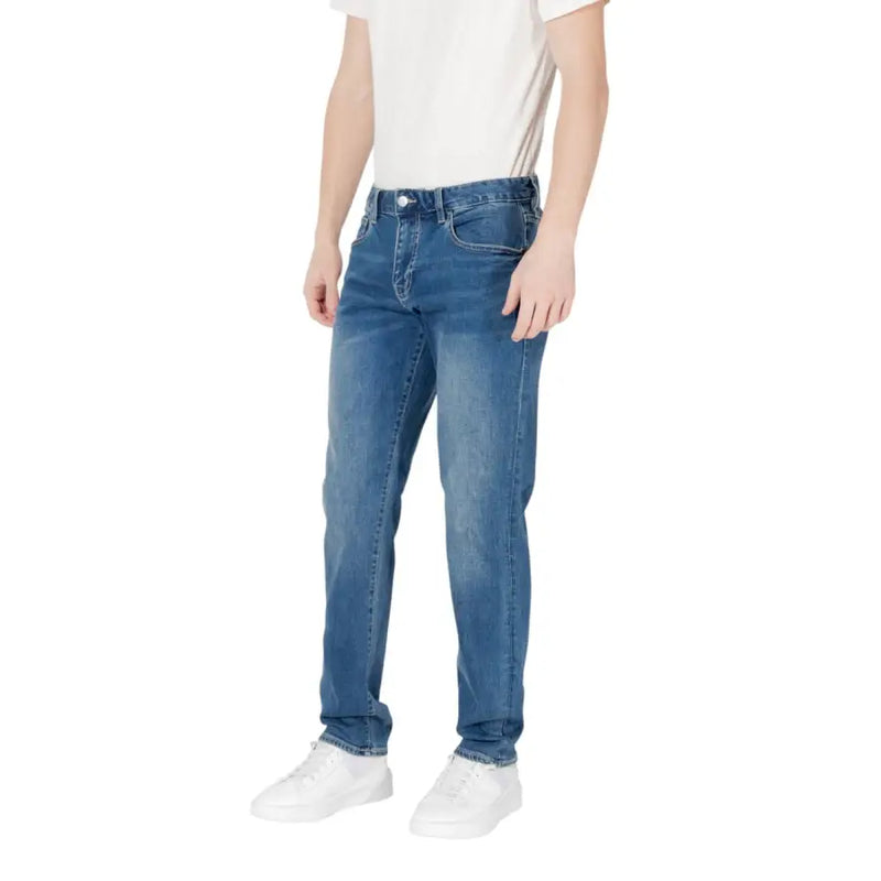 Man wearing Blue Jeans and a White T-Shirt showcasing casual men’s fashion