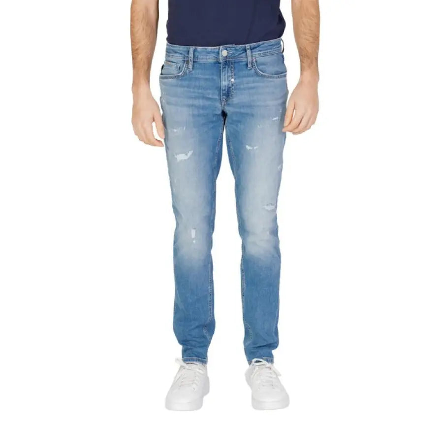 Man in Antony Morato blue t-shirt and Antony Morato jeans posing