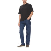 Man wearing a dark T shirt and blue jeans from the Black T Shirt Collection for Men