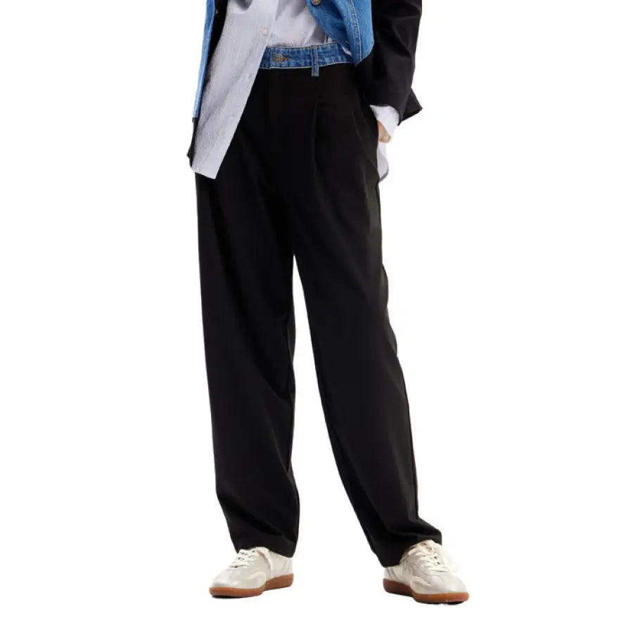 Man in Desigual denim jacket showcasing Desigual women trousers design
