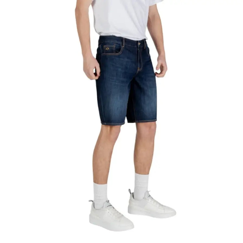 Man in denim shorts showcasing Armani Exchange Men Blue Cotton Shorts