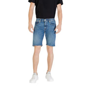 Man wearing stylish blue denim shorts showcasing casual summer fashion
