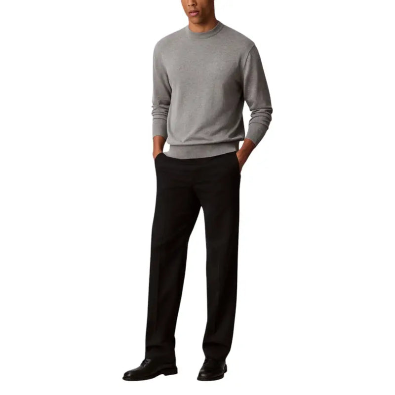 Man in gray long sleeved sweater and black pants displayed in Mens Gray Long Sleeved Sweater with Black Pants