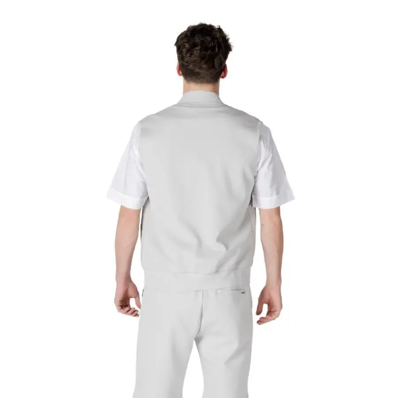 Man in gray workwear showcasing the Light Gray Vest and Shorts Set