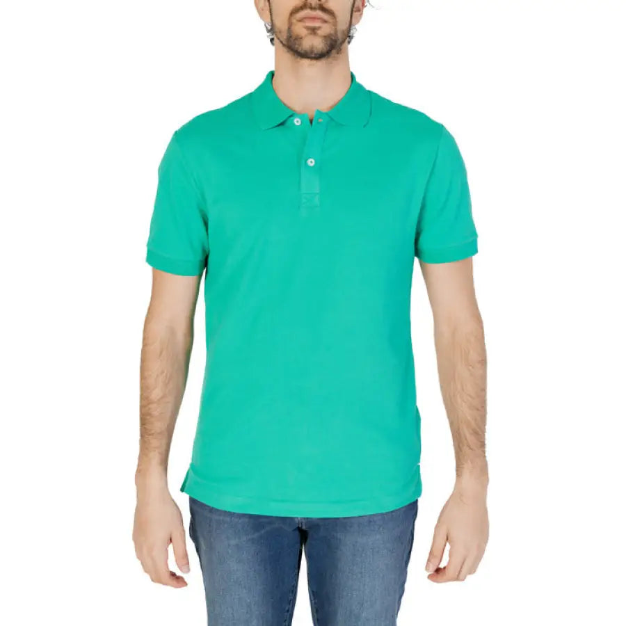 Man in green Gas Polo showcasing urban city style clothing