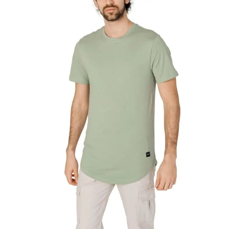 Only & Sons men t-shirt model wearing green shirt and cargo pants - apparel accessories