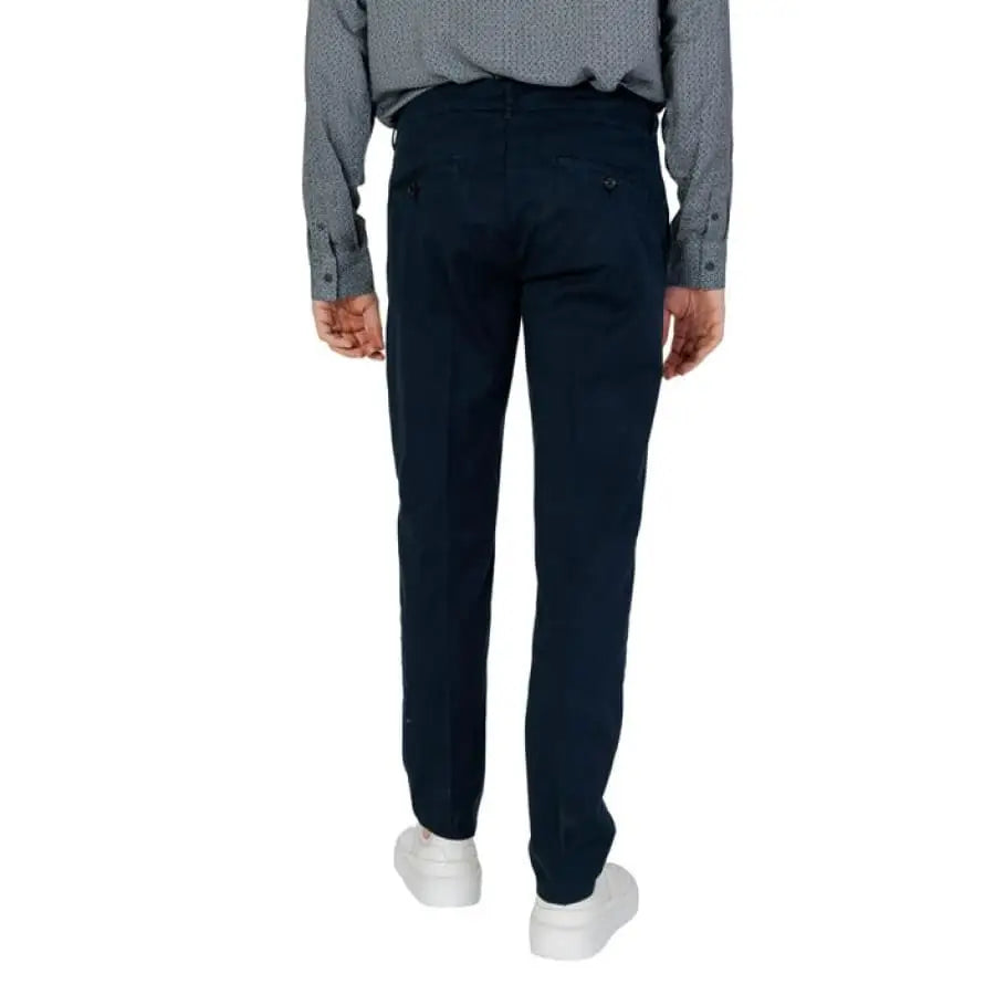 Antony Morato - man in grey shirt and black Antony Morato trousers.