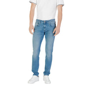 Man wearing light blue denim jeans and white sneakers from Mens Light Blue Denim Jeans and White Sneakers collection