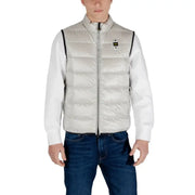 Man showcasing a stylish Light Gray Puffer Vest for Men in casual outdoor setting