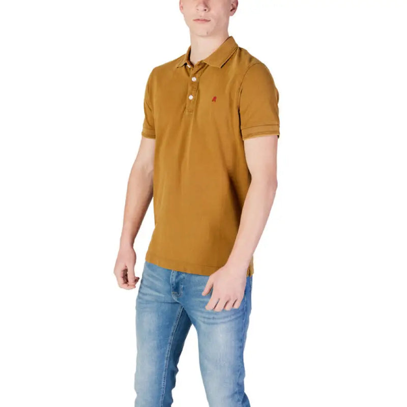 Man wearing Replay Men’s Yellow Short Sleeve Polo Shirt with jeans