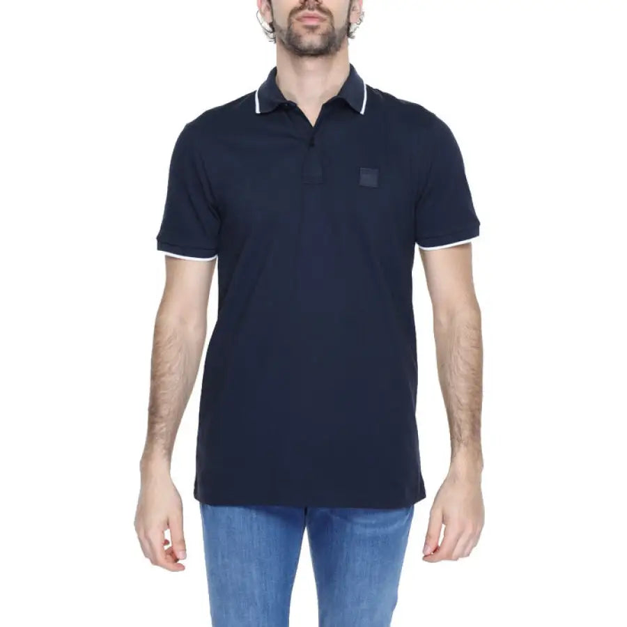 Man in Boss Men Polo with navy and white, showcasing urban city style
