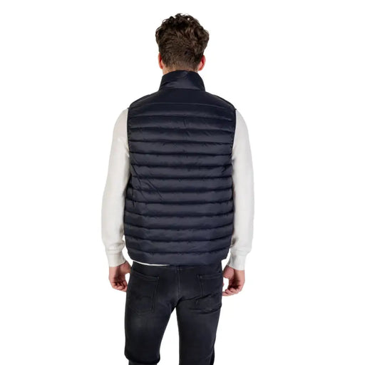 Man wearing a navy blue puffer vest showcasing the Navy Blue Puffer Vest product