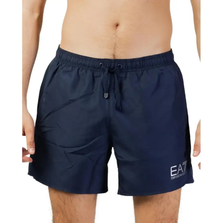 
                      
                        Ea7 EA7 Men Swimwear - Model wearing navy swim shorts from EA7 collection
                      
                    